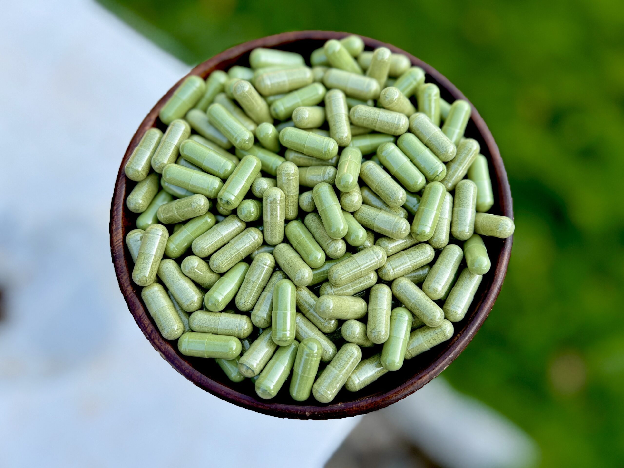 Moringa capsules in a bowl